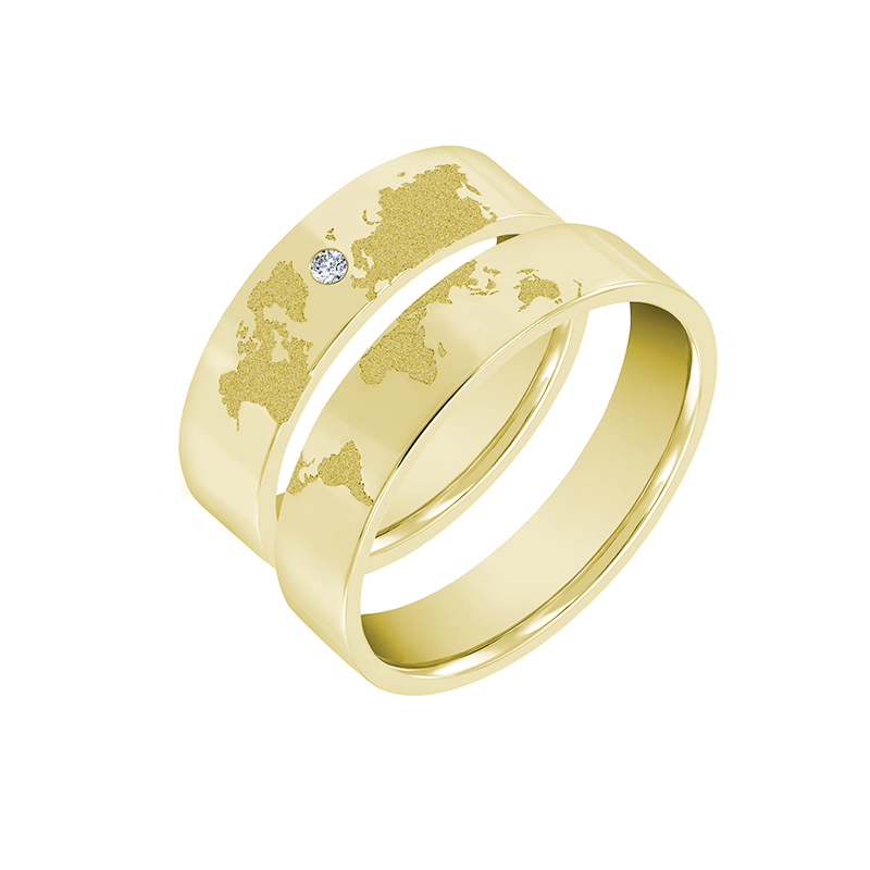 Goldene Trauringe mit Gravur der Weltkarte und Diamant Zeoni 35655